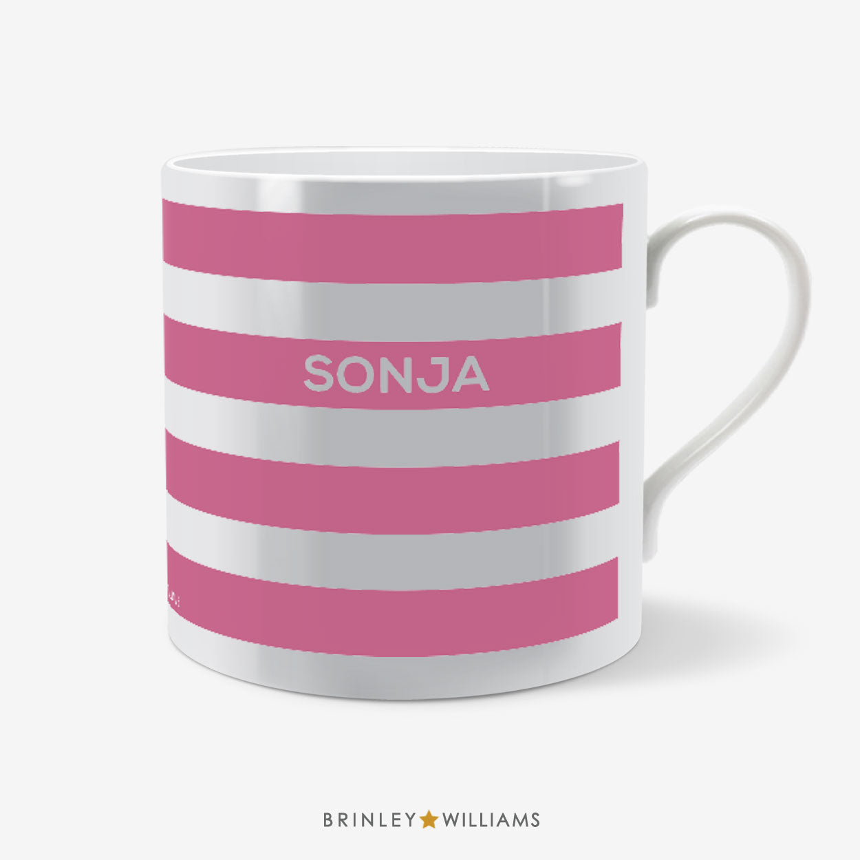 White mug with pink stripes and 'SONJA' text on a white background, branded 'Brinley Williams'.