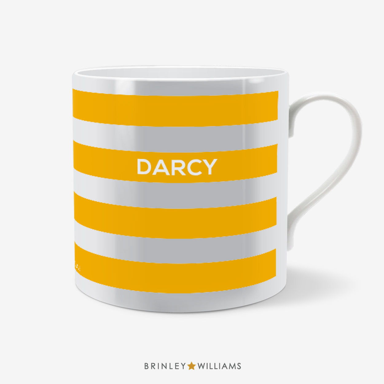 White mug with yellow stripes and 'Darcy' text on a white background, branded 'Brinley Williams'.