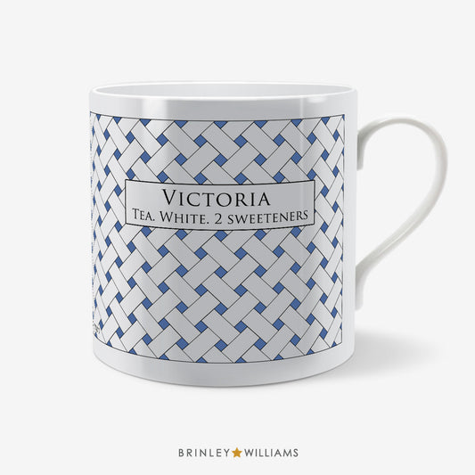 Personalised mug with blue weave pattern by 'Brinley Williams'.