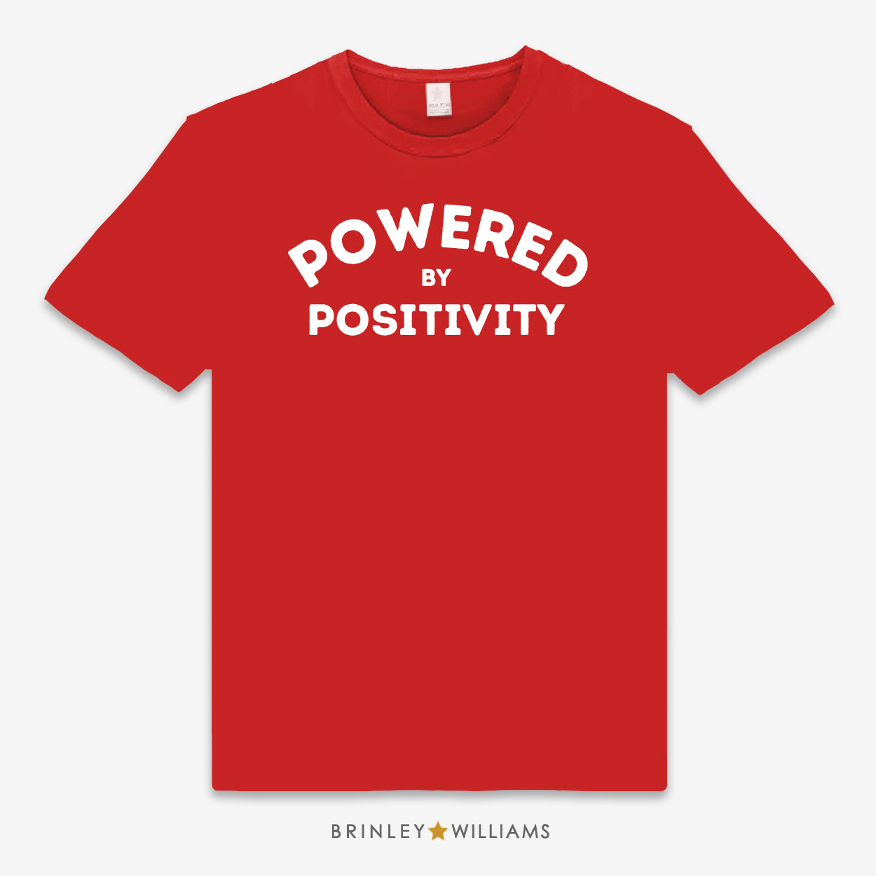 A Red unisex t-shirt with the text 'POWERED BY POSITIVITY' printed on the front.
