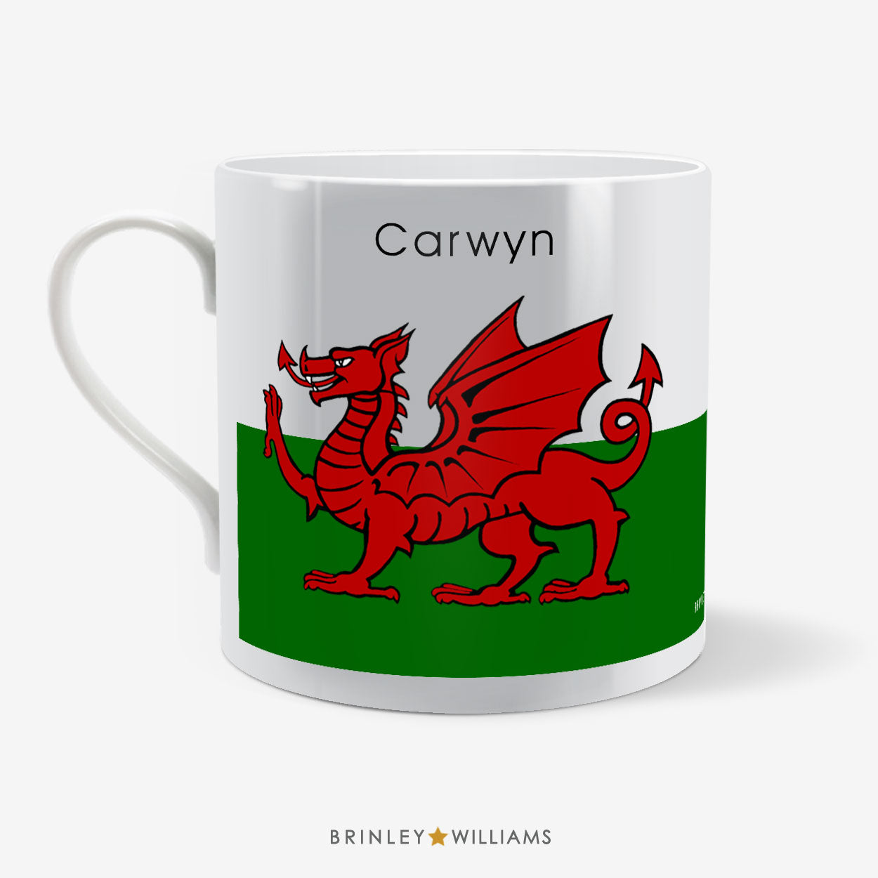Mug with a red dragon design on a green and white background, featuring the name 'Carwyn'  on the reverse side and 'Brinley Williams'.